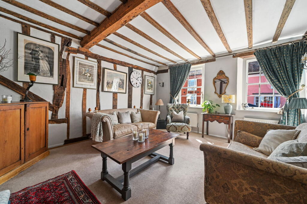 Beamed reception room with historic charm
